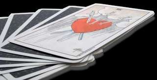 immagine che ritrae una carta su cui è raffigurato un cuore trafitto da tre spade