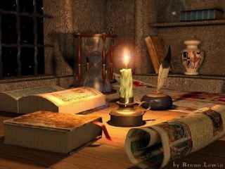 immagine che ritrae una candela accesa al centro di libri da divinazione